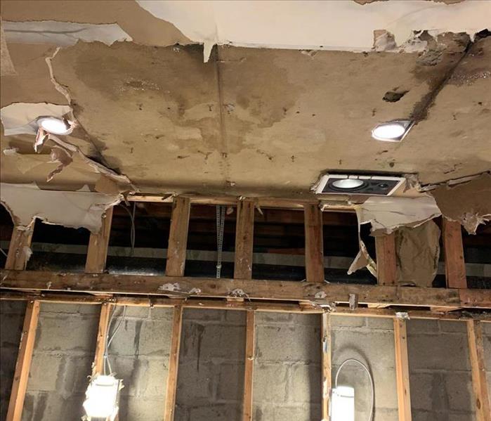 Water damage to ceiling and wall. 