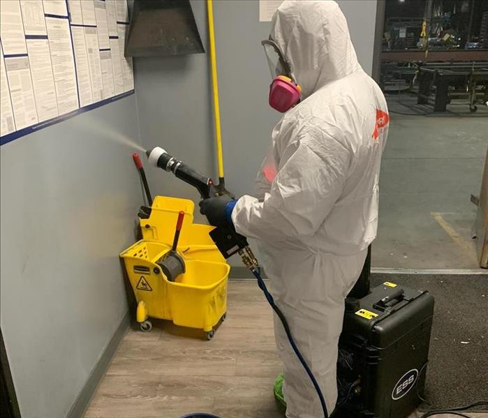 service working cleaning and sanitizing work space