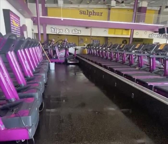 water on the floor of a gym 